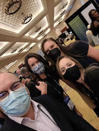 The HiringThing team poses together at PrismHR LIVE (with their masks on, of course!).