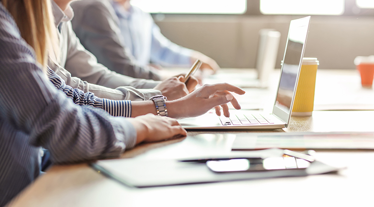 Workers brainstorm via keyboard about how their PEO can stay competitive in a growing market. 