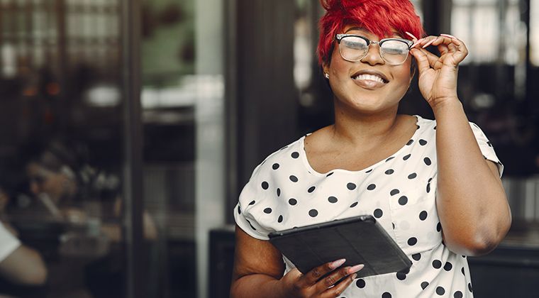 A job candidate smiles after a great hiring experience. 