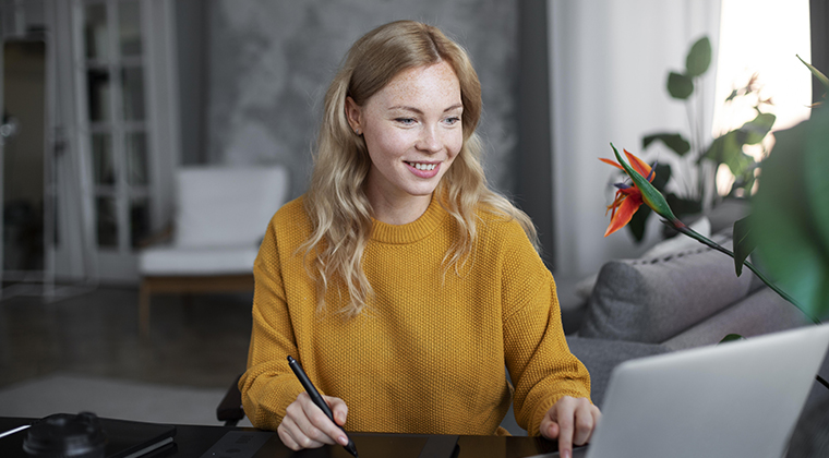 Person in yellow sweater interviewing for remote position