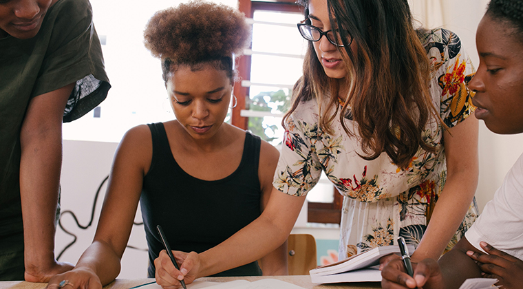 A PEO employee helps members of a small business with their recruiting issues. 